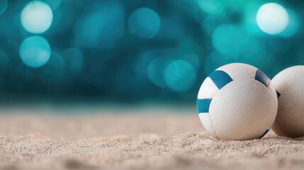 Vibrant beach volleyball court with colorful balls and nets set up on sandy surface ready for a fun summer sports game or tournament