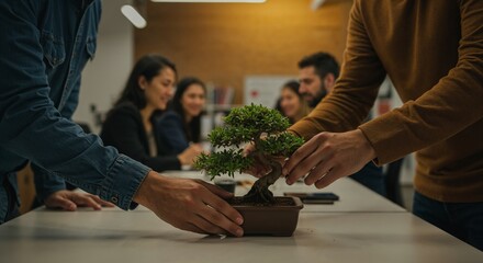 Team collaboration in modern office setting as colleagues engage in nurturing a bonsai tree, symbolizing growth, teamwork, and attention to detail in a creative workspace