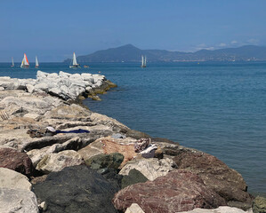 Sestri Levante, Italy - July 15, 2025. Sailboats in sea. Sport and sailing school for teenagers and adults. Nature and vacation in Italy. Leisure and seasons.