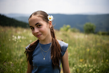 Young girl enjoying nature in scenic meadow