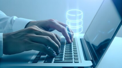 Hands Typing on Laptop with Digital Database Icon – Data Management and IT Concept