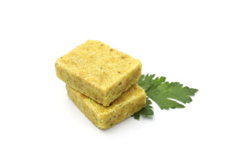 Aromatic bouillon cubes and parsley isolated on white