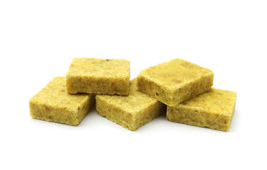 Many aromatic bouillon cubes isolated on white