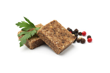 Aromatic bouillon cubes, parsley and peppercorns isolated on white