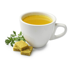 Aromatic bouillon cubes, broth and parsley isolated on white