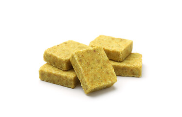Many aromatic bouillon cubes isolated on white