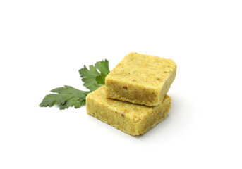 Aromatic bouillon cubes and parsley isolated on white