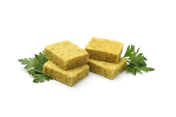 Aromatic bouillon cubes and parsley isolated on white