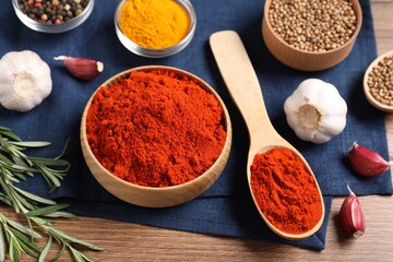 Different aromatic spices on wooden table, closeup