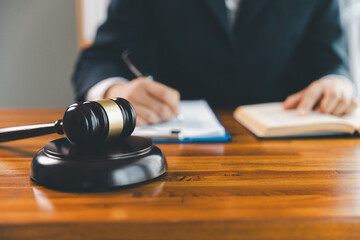 Justice and lawfirm concept. Female lawyer in office with brass scale. Woman hand gavel to bang....