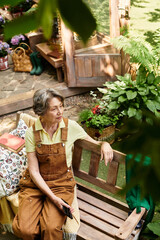 Senior woman enjoying a serene moment in her vibrant garden sanctuary