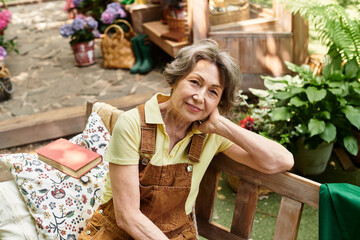 Enjoying a peaceful moment in the garden surrounded by vibrant flowers and greenery