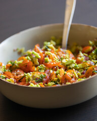 close up stock photo of fresh homemade guacamole in a bowl, perfect for summer, healthy snacking, and refreshing party appetizers