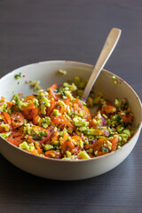 close up stock photo of fresh homemade guacamole in a bowl, perfect for summer, healthy snacking, and refreshing party appetizers