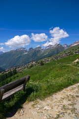 Viewpoint with wooden bench at hiking trail in the Swiss Alps at Lauchernalp at L&ouml;tschental Valley on a sunny late spring day. Photo taken June 19th, 2025, L&ouml;tschental Wiler, Switzerland.