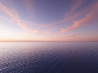 Fototapeta premium Calm water meeting a soft colored sunset as wispy clouds create a serene and peaceful scene