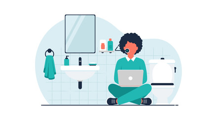 A young woman sits cross-legged on the bathroom floor, using her laptop while wearing a headset, in a minimalist, modern bathroom setting.