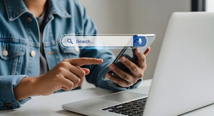Searching online using mobile phone and laptop for information internet technology concept