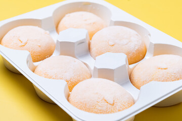 Japanese Mango ice cream mochi on yellow background