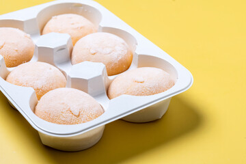 Japanese Mango ice cream mochi on yellow background
