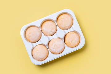 Japanese Mango ice cream mochi on yellow background