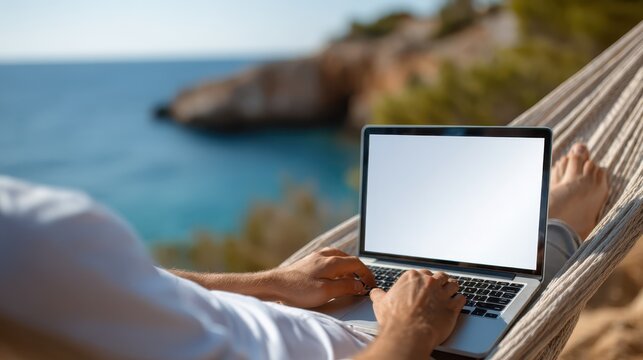 Relaxing while working on a laptop in a beautiful beachside hammock - Powered by Adobe