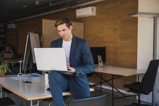 Businessman using laptop in office