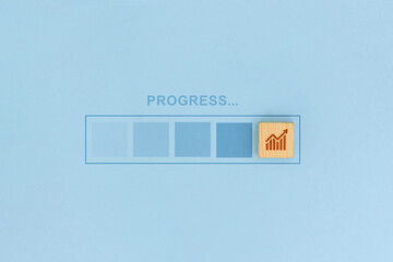 Business Progress Bar and Growth Chart Wooden Block Concept