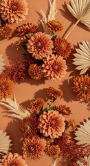 Autumnal floral arrangement with dahlias and dried palm leaves pattern background