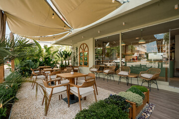 Cozy Café Atmosphere with Natural Light and Relaxed Ambience


