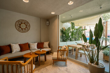 Cozy Café Atmosphere with Natural Light and Relaxed Ambience


