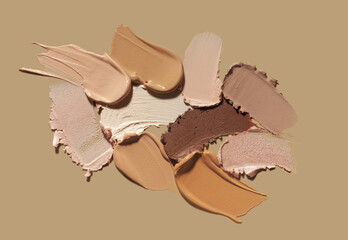 Set of different textures of cosmetic foundation, concealer, highlighter, soft powder, bronzer, on...