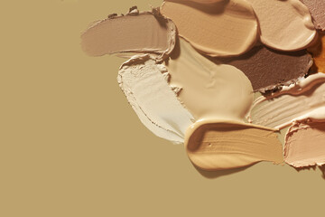 Set of different textures of cosmetic foundation, concealer, highlighter, soft powder, bronzer, on...