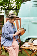 Senior woman enjoys leisurely afternoon in a vibrant garden filled with tranquility and joy