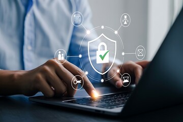 Secure Online Data Protection: Businessperson Using Laptop with Digital Shield Icon