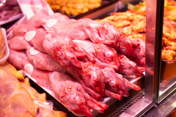 Raw rabbit carcasses on store shelf