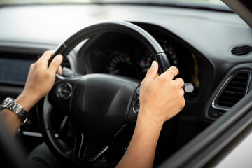 Focused Driving. Hands gripping the steering wheel of a car.