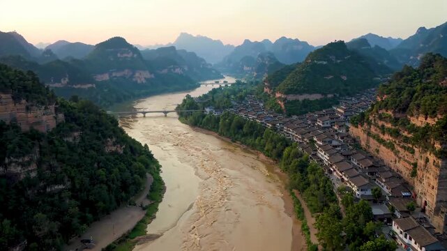 Aerial photography of the Danxia landform in the ancient river town and the scenery of the ancient town among the mountains and rivers