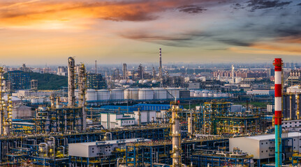 Oil refinery and chemical plant in large industrial area at sunset