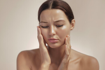 Young Woman Pressing Cheeks In Painful Toothache Concept Studio Portrait