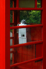 Vintage coin base dial-in telephone in red boot