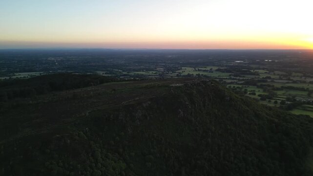 The stunning Cloud at Bosely on a full moon weekend at sunset, Staffordshire UK - drone very slow clockwise rotate from far