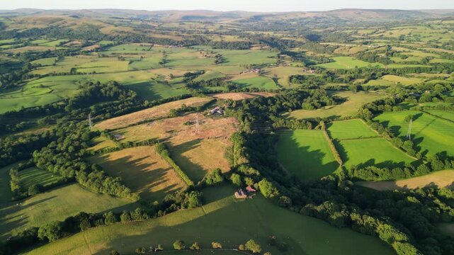 Staffordshire countryside rural drone flyover from the Cloud at Bosely during golden hour, UK