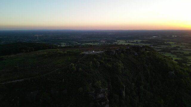 The stunning spiritual Cloud at Bosely on a full moon weekend at sunset , Staffordshire UK - drone fast clockwise rotate