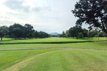 Serene Outdoor Golf Course Greenery Landscape Scenery Under Cloudy Sky