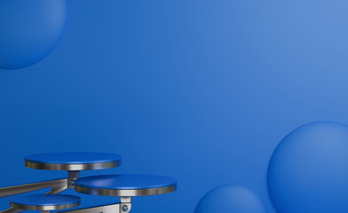 A minimalist 3D rendering with a predominantly blue color scheme features a multi-tiered round platform on the left and a cluster of blue spheres of varying sizes on the right against a plain blue bac