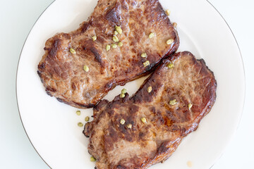 grilled steak on a plate close up
