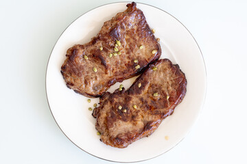 grilled steak on a plate close up