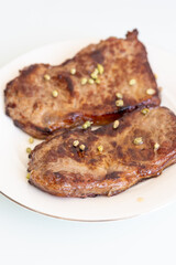 grilled steak on a plate close up