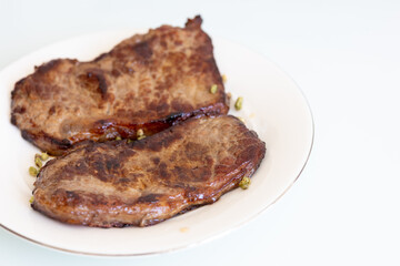 grilled steak on a plate close up